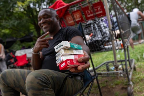 Migrant peddling cigarettes.